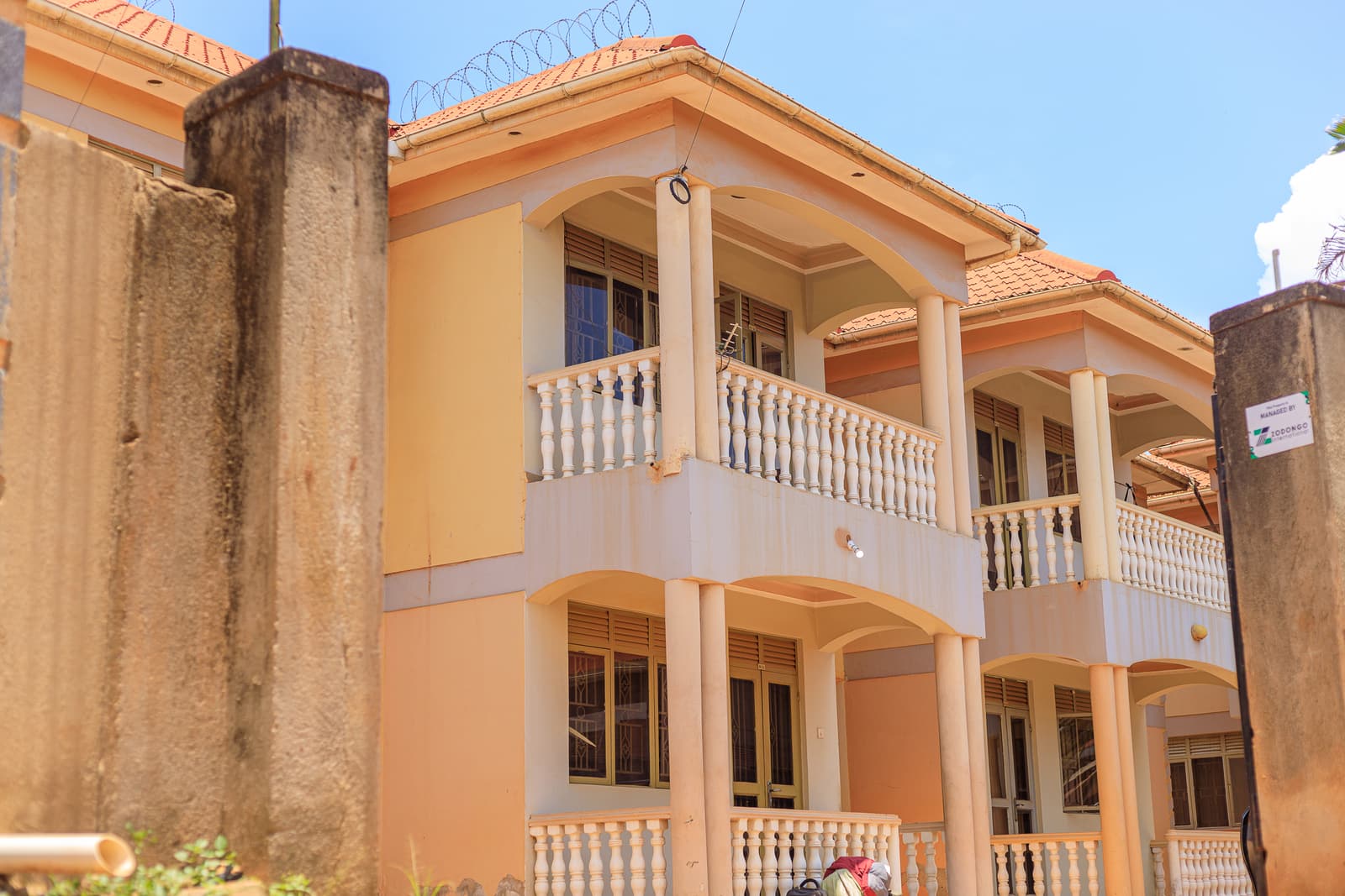 Terrace row under clear Kampala skies